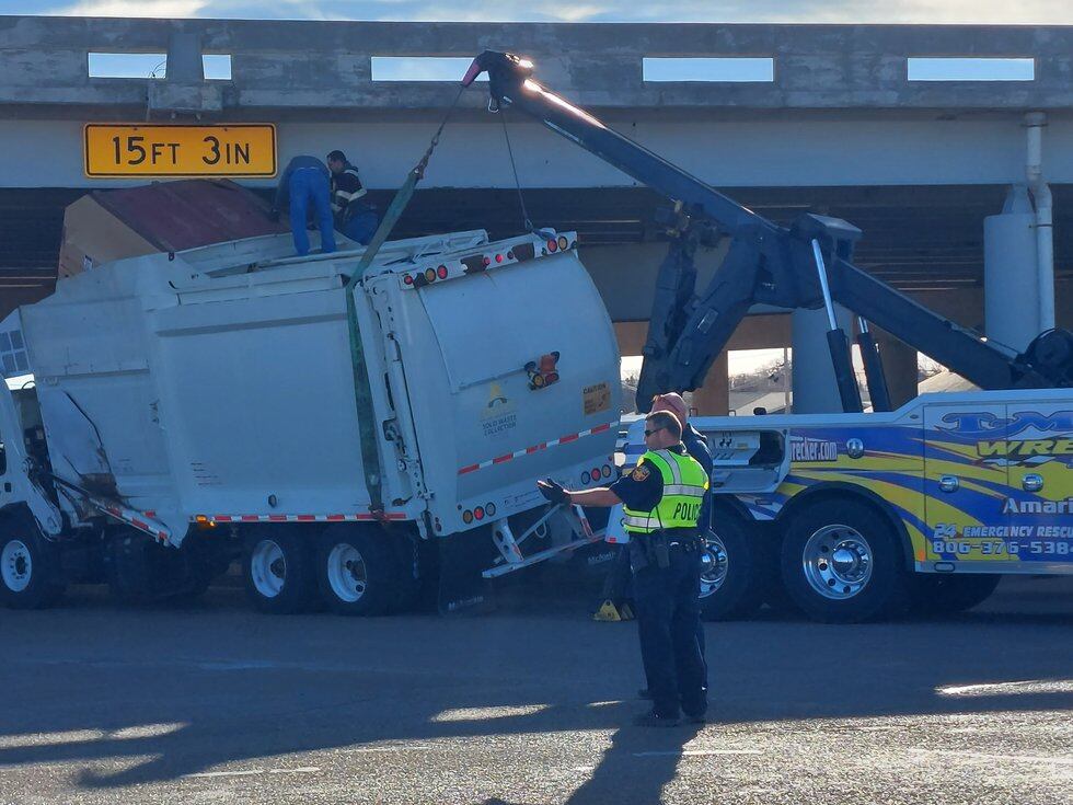 City of Amarillo trash truck stuck under overpass