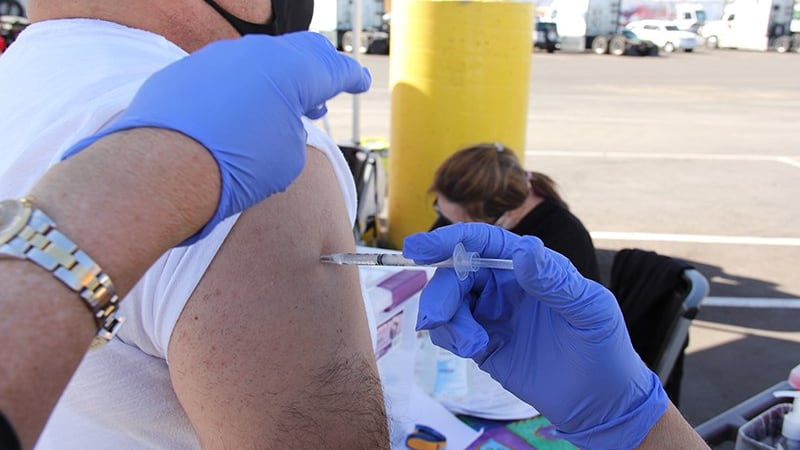 An essential worker gets vaccinated at a special event Bashas' food stores set up for its...